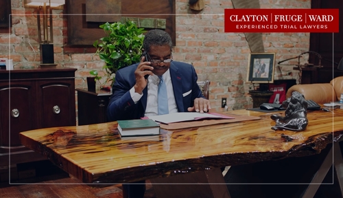 attorney clayton at a desk